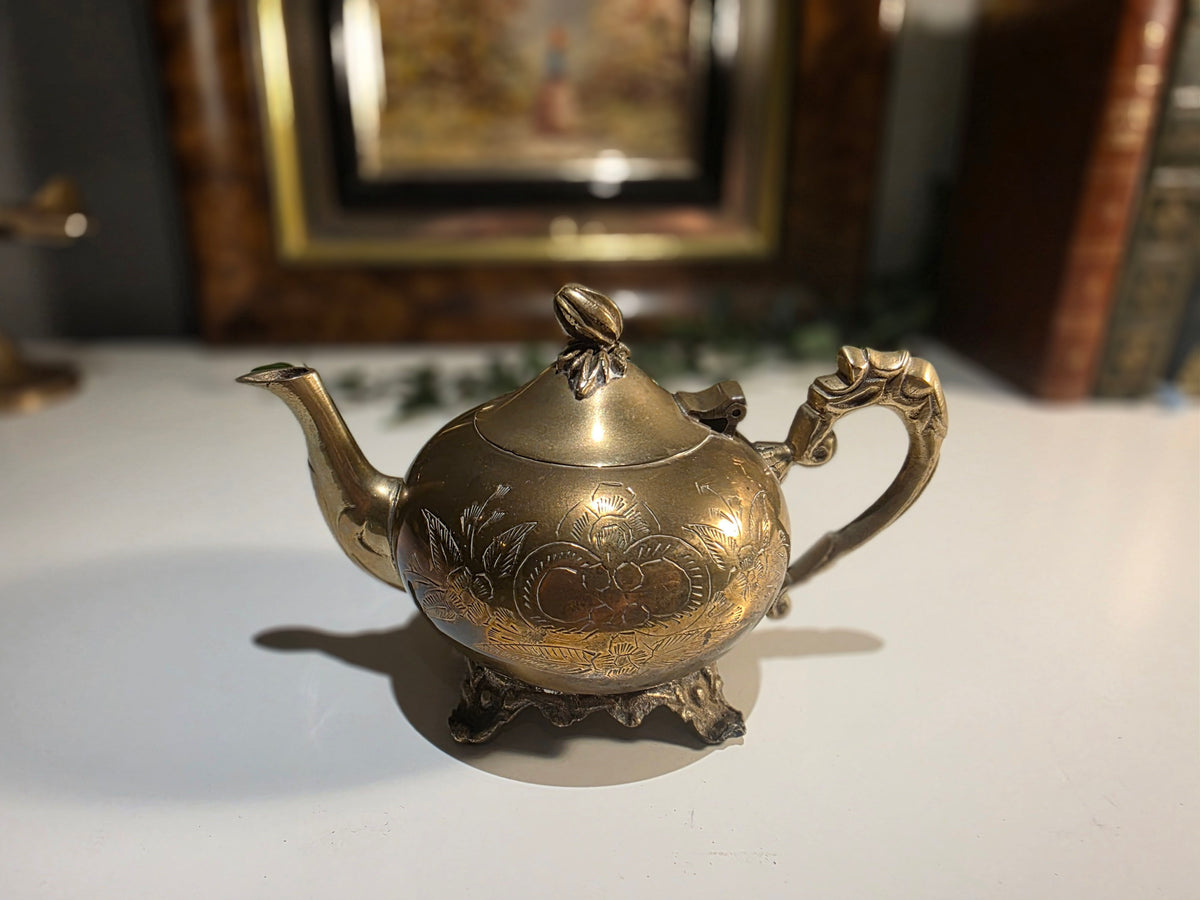 Antique-Style Brass Floral Engraved Teapot with Ornate Handle and Footed Base